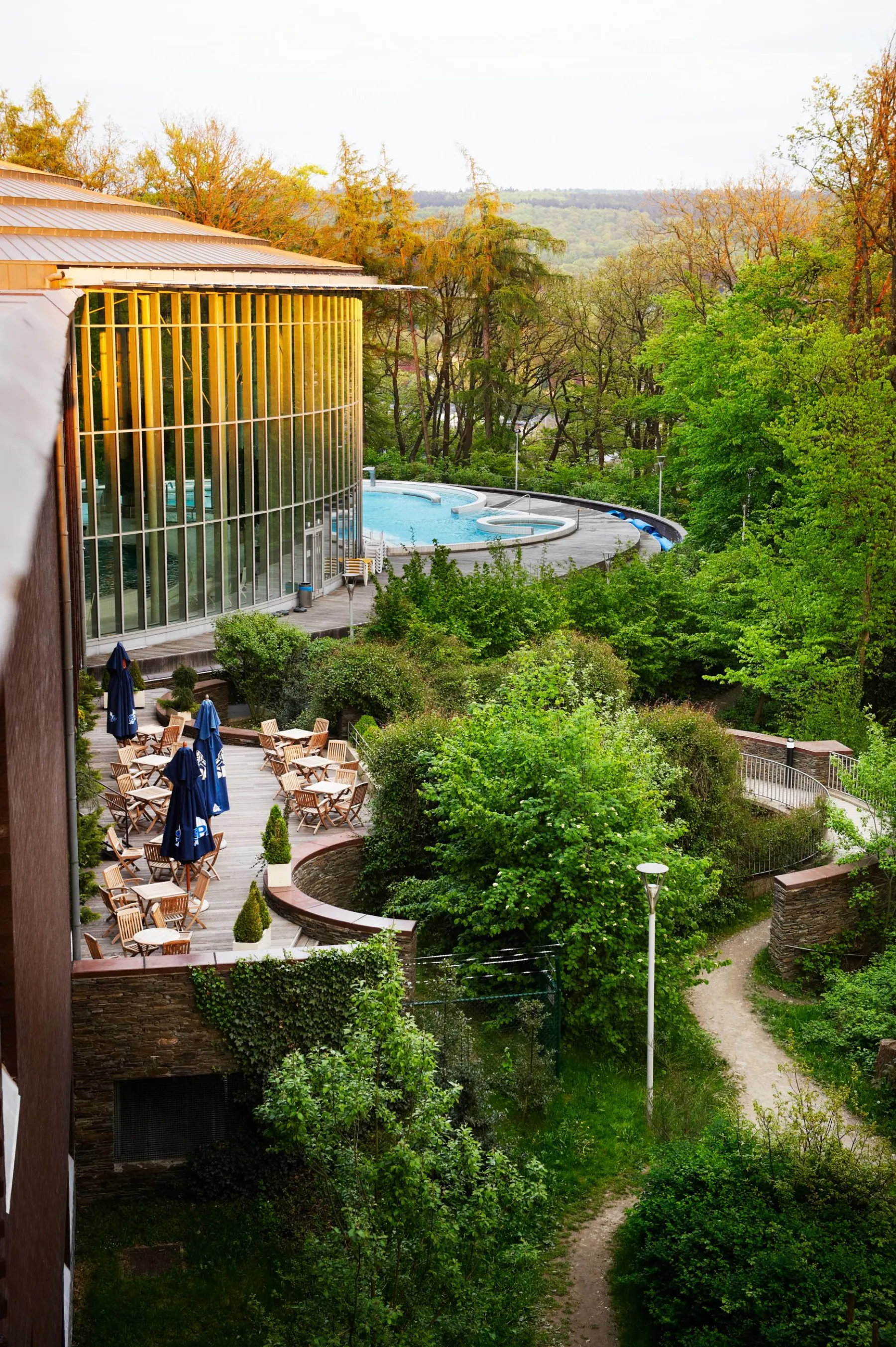 Elevated view of the Thermes de Spa above the wooded slopes of Spa
